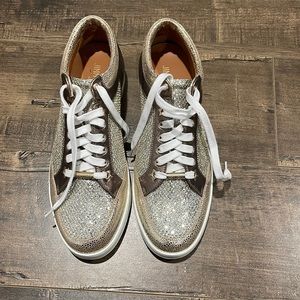 Jimmy Choo Brand new sneakers , shiny gold with gold clusters on the toe area.
